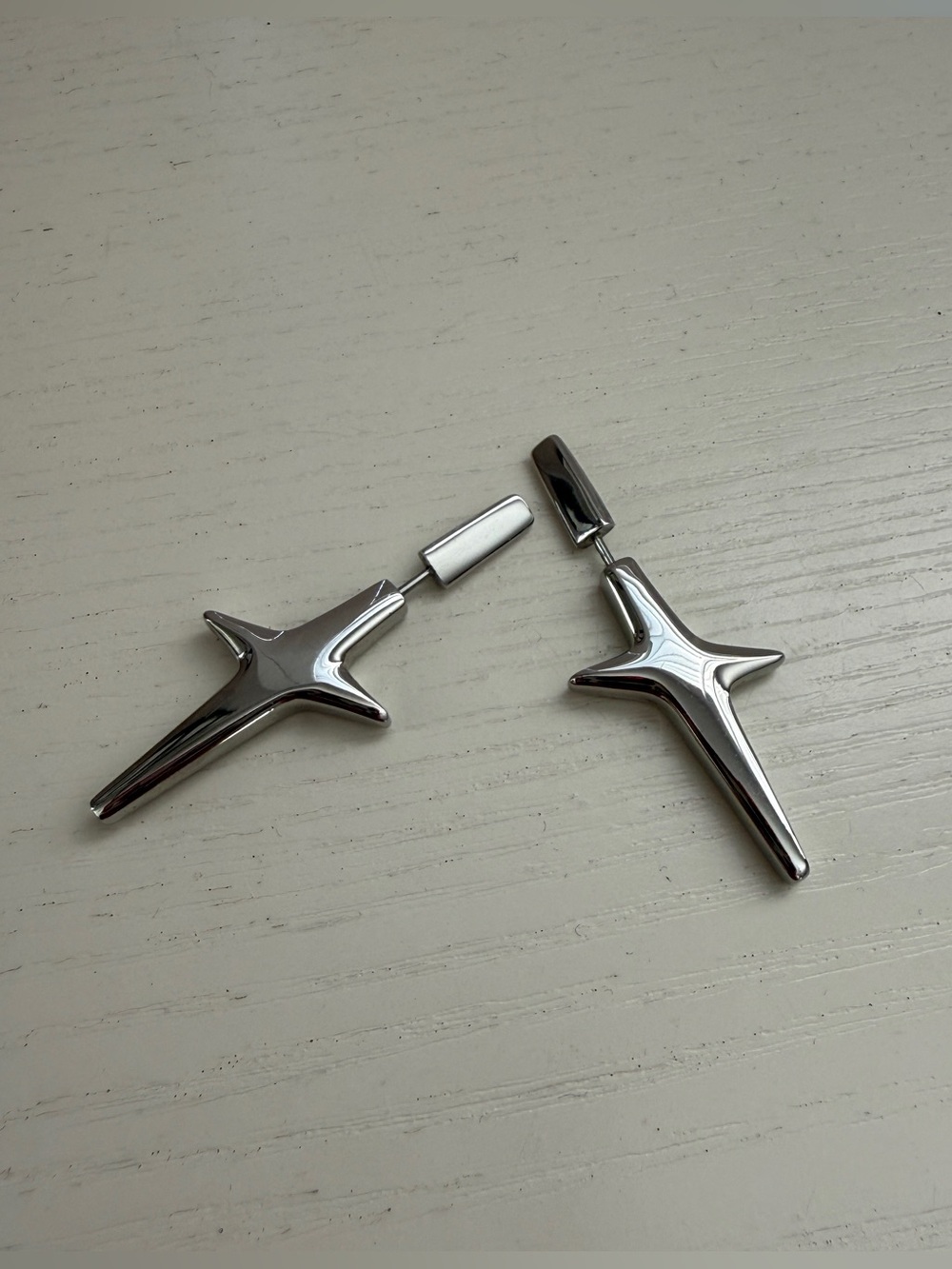 Chrome star-shaped earrings with a modern, geometric design #geometric
